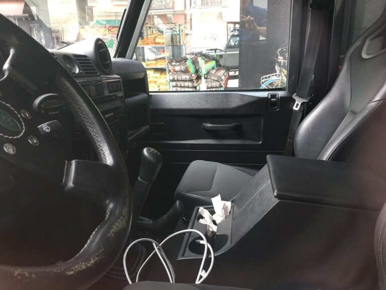 Land Rover Defender 110 (L316), driver's seat and steering wheel photographed through left side window