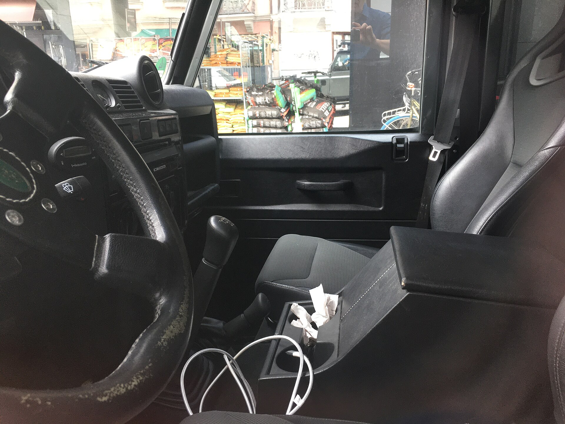 Land Rover Defender 110 (L316), driver's seat and steering wheel photographed through left side window