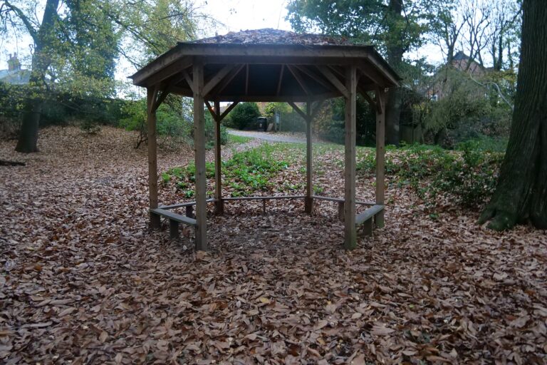 Wooden Gazebo, in autumn with leaves on the ground